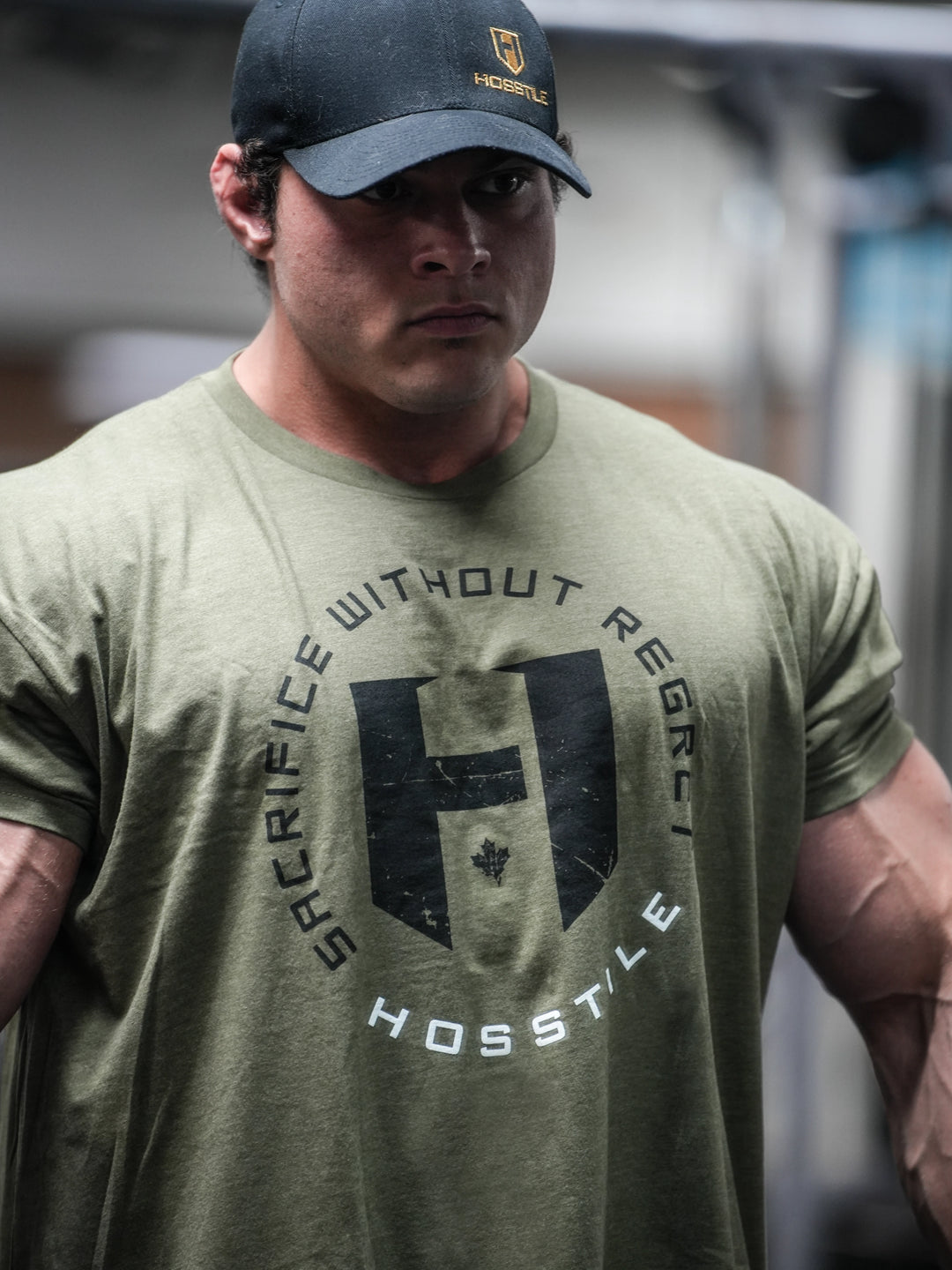 Bodybuilder wearing the OG Sacrifice Gym T-Shirt#color_military-green