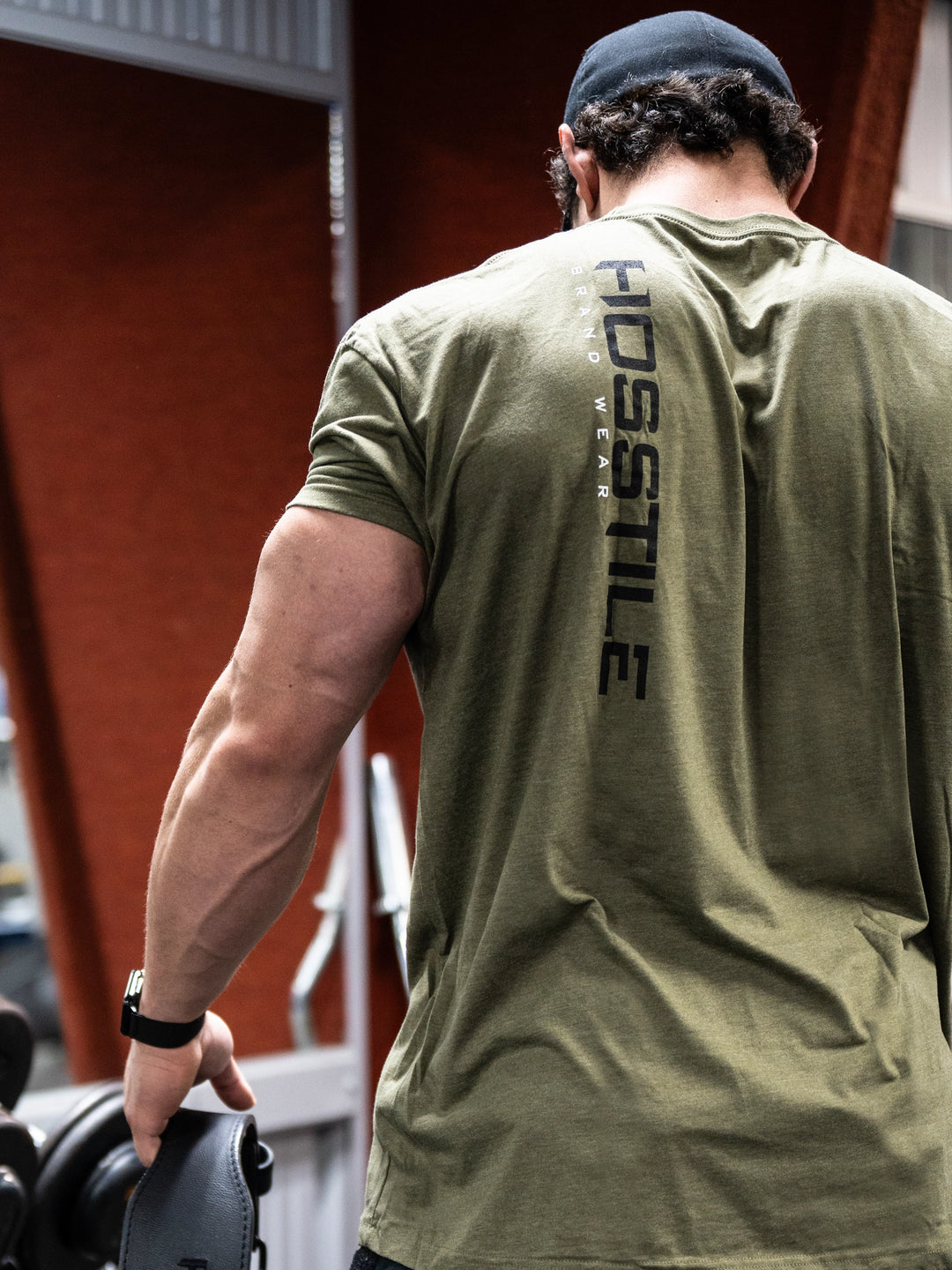 Bodybuilder wearing the OG Sacrifice Gym T-Shirt#color_military-green